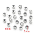 Silver steel-color diamond-cut stainless steel wheel spacer beads with size measurements on white background