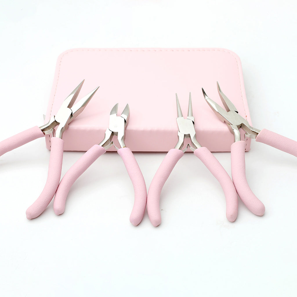 Five pink-handled wire cutters in front of a small pink case