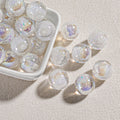 Clear round candy-core opal-effect resin beads filled with white glitter and iridescent flecks