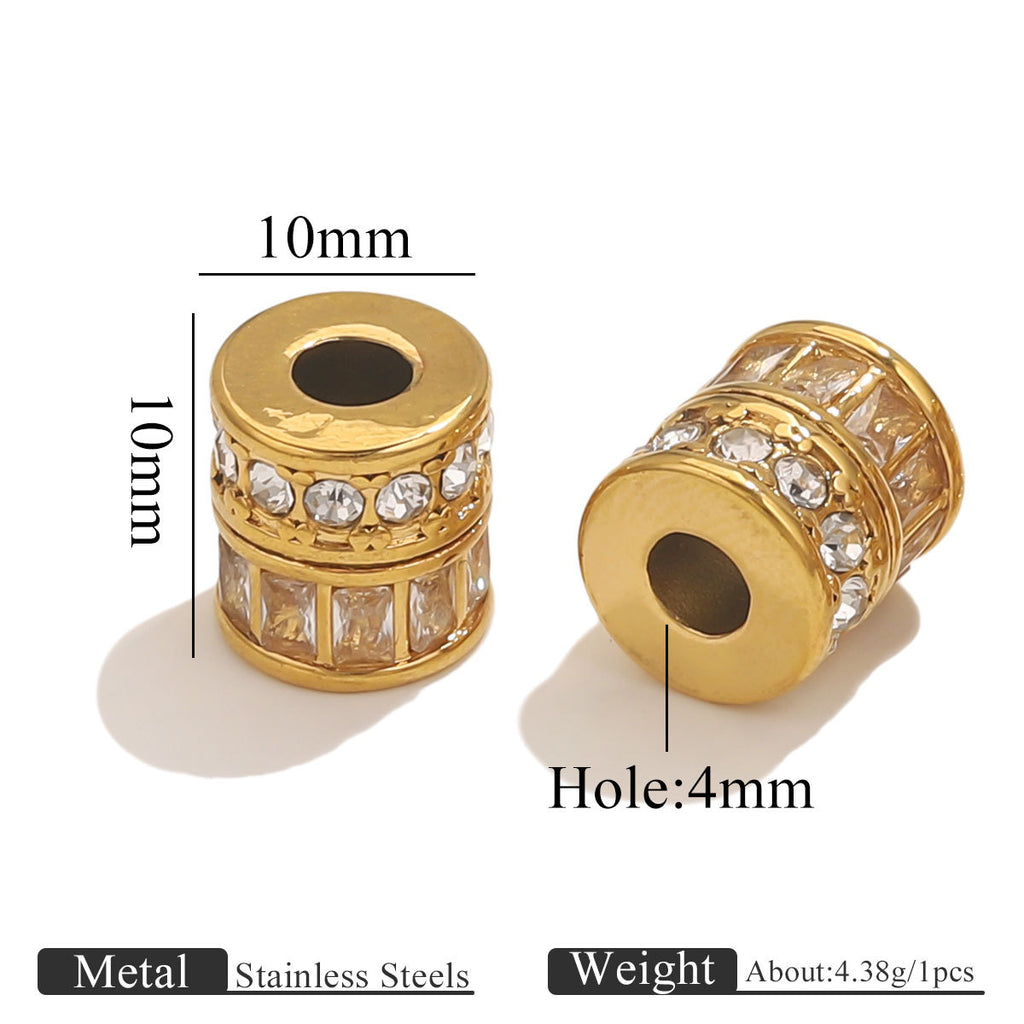 Two gold cylindrical spacer beads with clear rhinestones, shown on a white background with dimension labels (10mm diameter, 4mm hole) and text noting stainless steel material and weight.