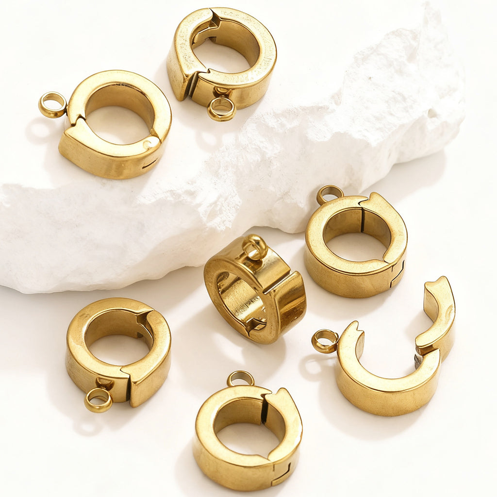 Close-up of gold stainless steel open-ring connector clasps