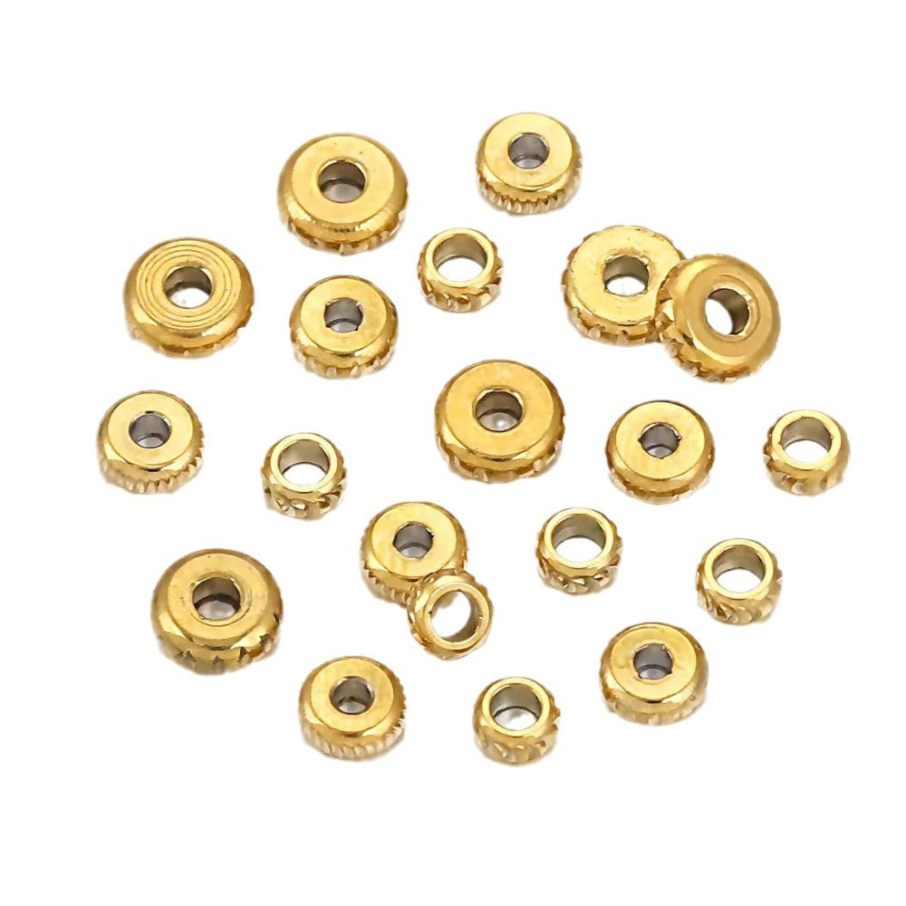 Gold-plated diamond-cut stainless steel abacus spacer beads with fluted edges, top view