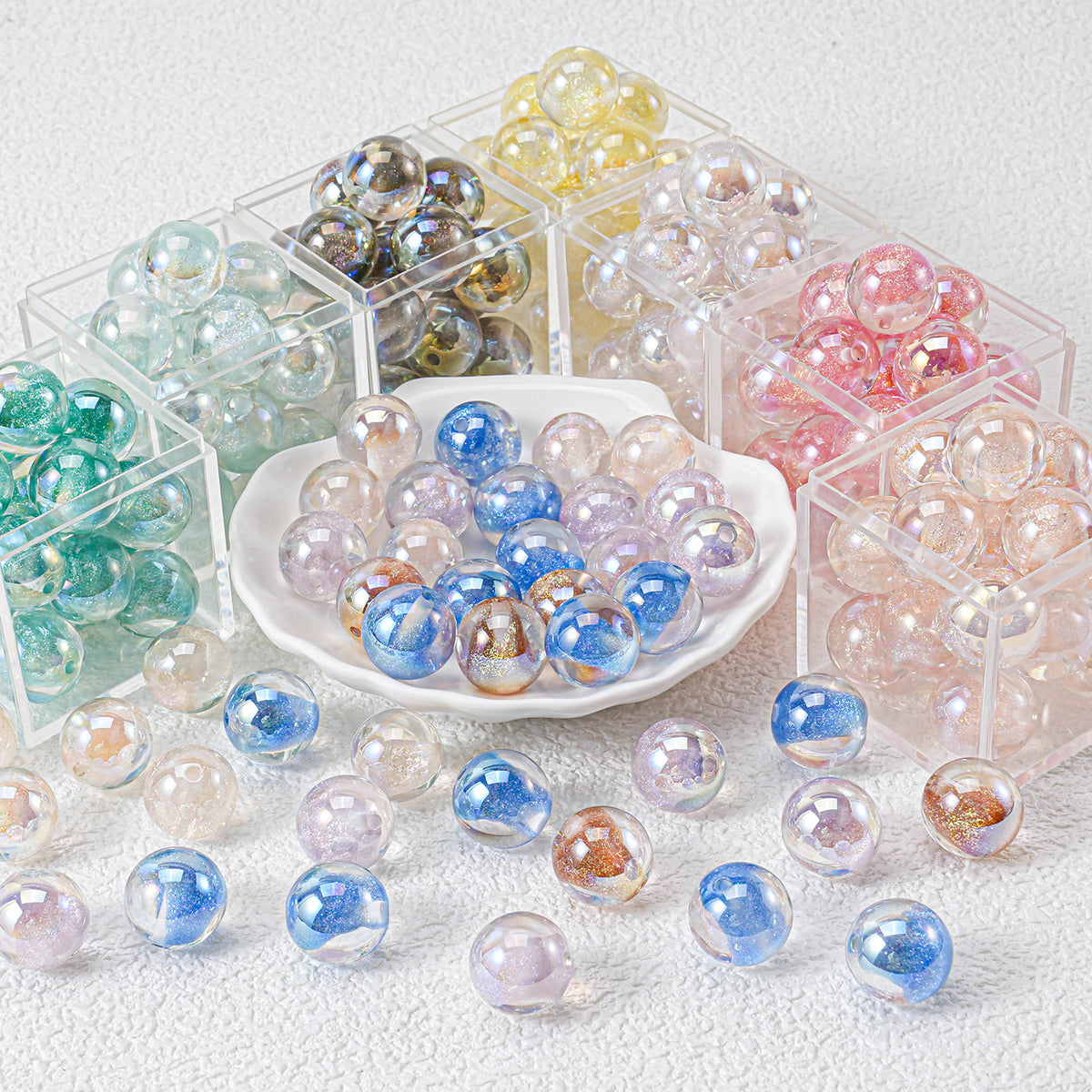 Iridescent round beads in assorted pastel colors displayed in clear plastic storage boxes