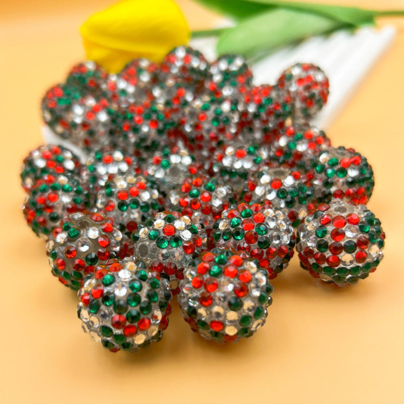 Pile of round Christmas rhinestone beads in red, green and clear