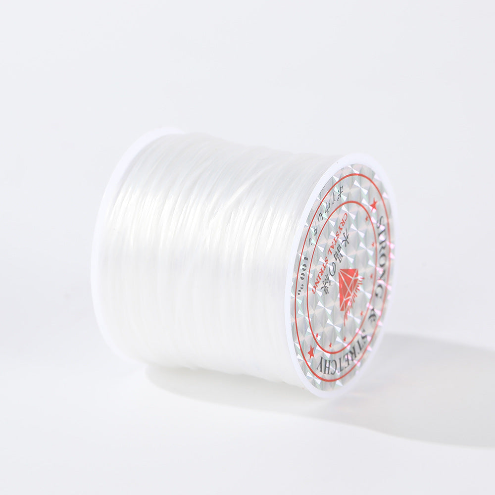 Spool of clear 0.8mm flat elastic beading cord with a white and red labeled end, on a white background
