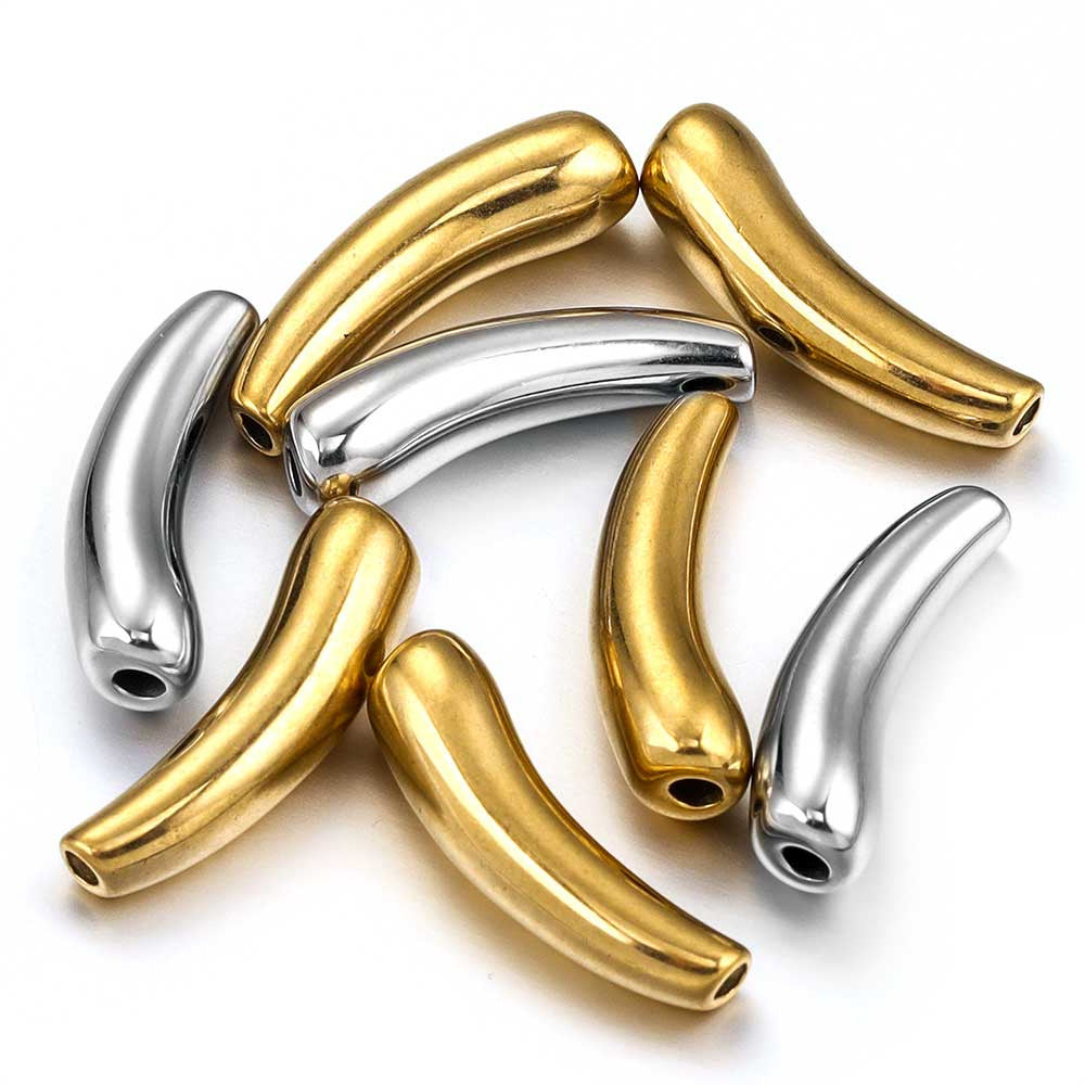 Six metallic curved beads in polished gold and silver finishes, arranged on a clean white background.