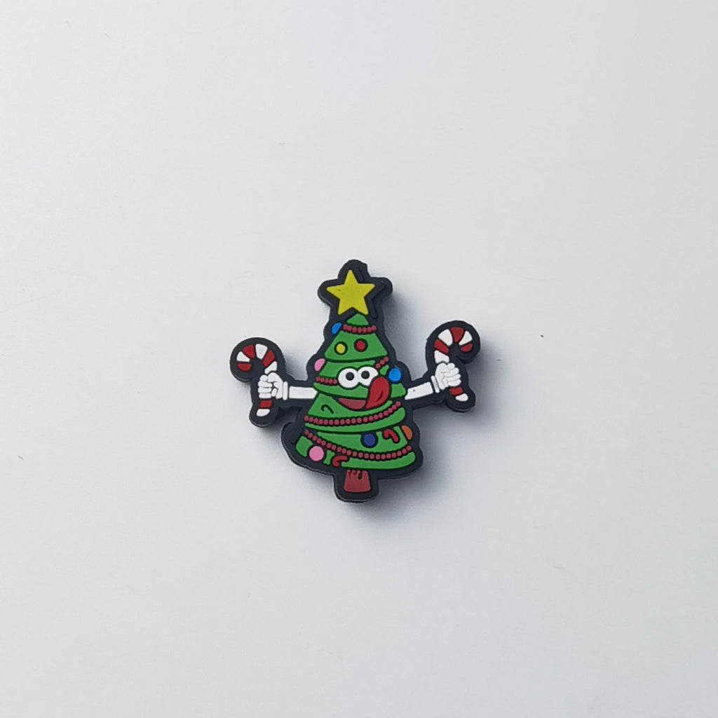 Green Christmas tree silicone focal bead with smiling face, yellow star and candy canes in both hands