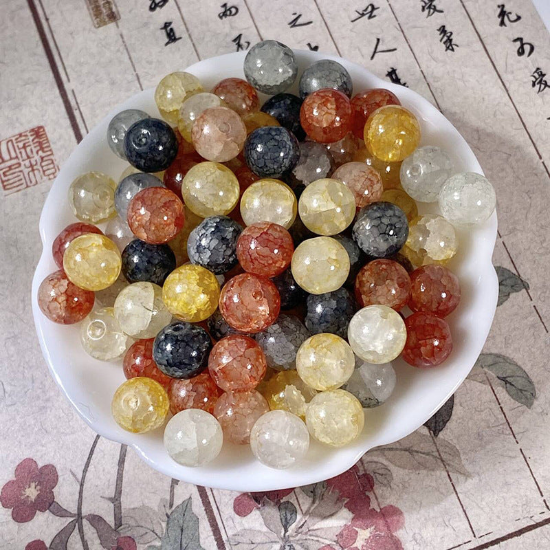 White ceramic bowl filled with assorted color faceted round beads