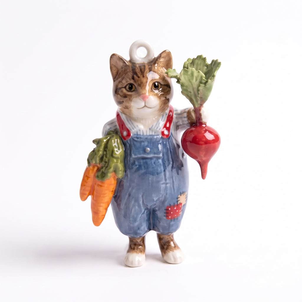 3D kitten pendant charm wearing blue overalls, holding carrot and red beet.