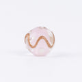 Single pink gold-sand swirl glass bead with gold line and white dots