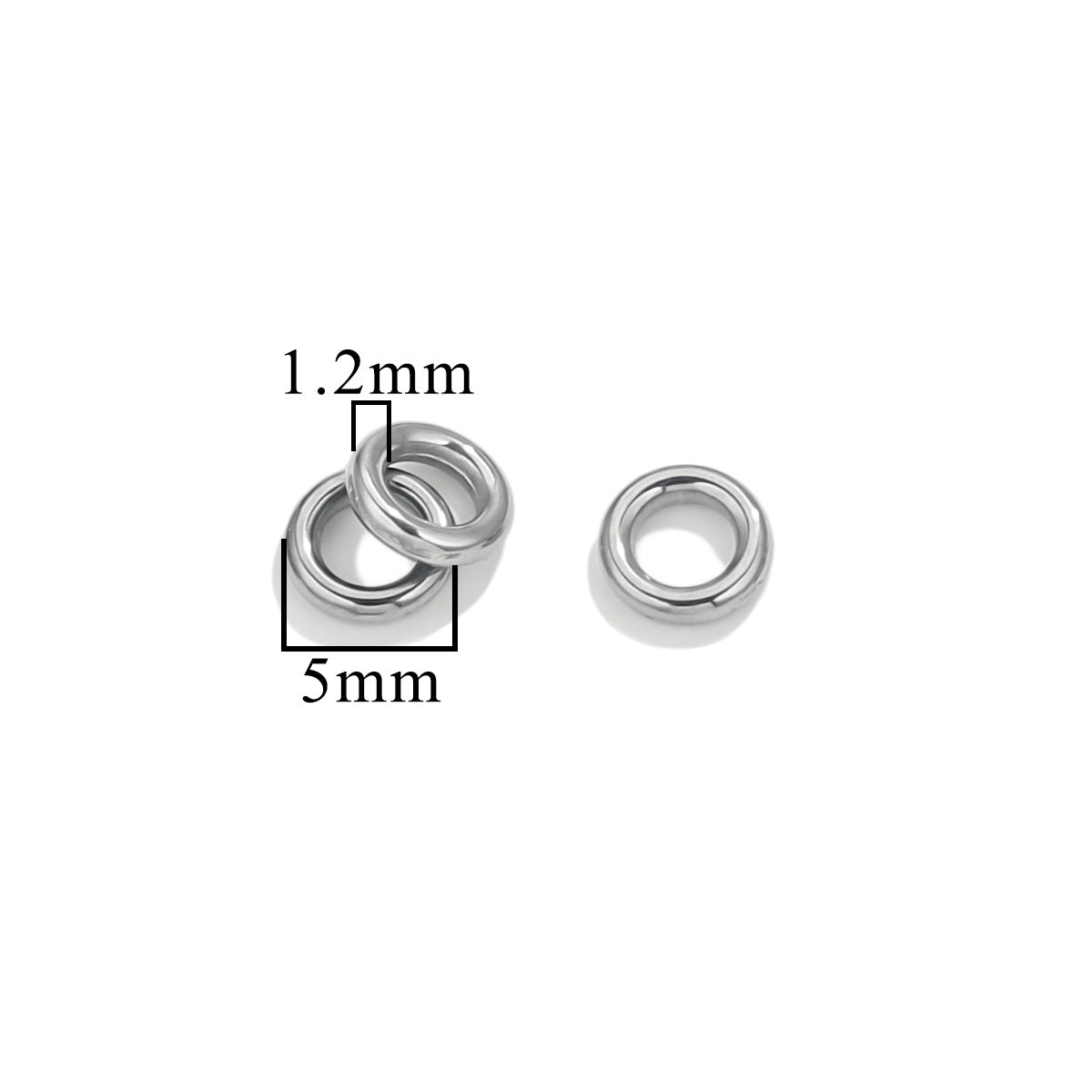 Three silver-tone closed jump rings, 5mm size with 1.2mm wire thickness, on white background