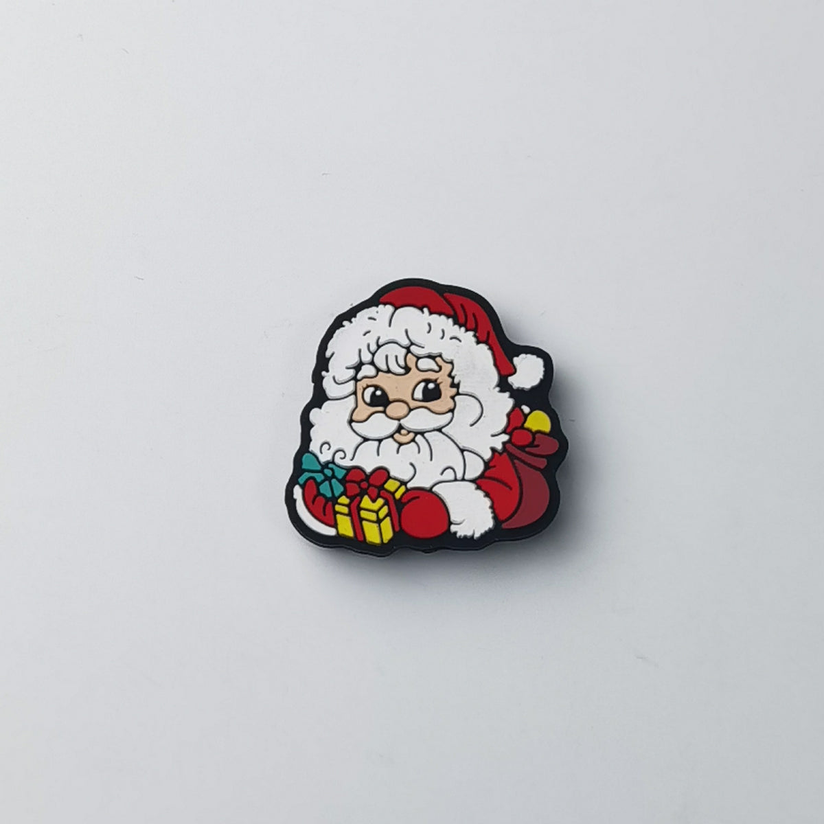 Cartoon Santa Claus silicone focal bead with red hat, white beard and red coat, holding wrapped gifts