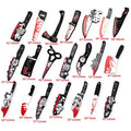 A set of 18 plastic toy kitchen knives and a pair of toy scissors arranged on a white background, each with a red measurement label underneath.