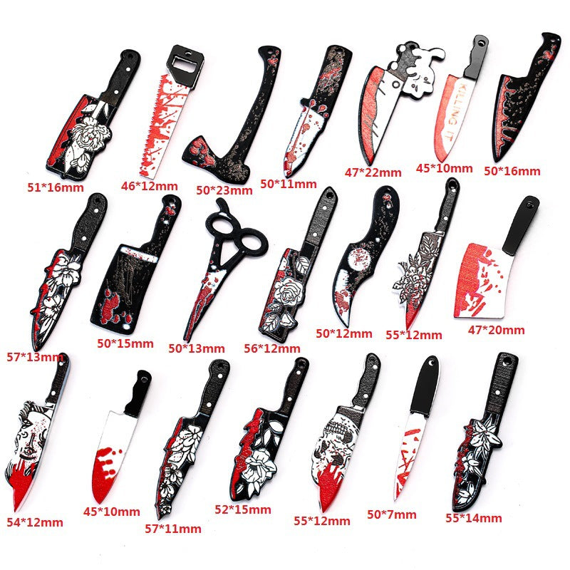 A set of 18 plastic toy kitchen knives and a pair of toy scissors arranged on a white background, each with a red measurement label underneath.