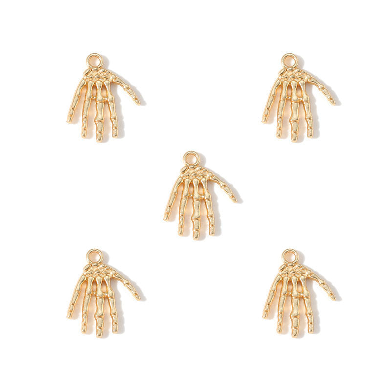 Five gold skeleton hand charms arranged on a plain white background.