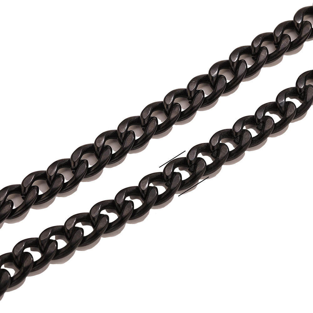 Close-up of black metal NK Cuban curb chain on a white background