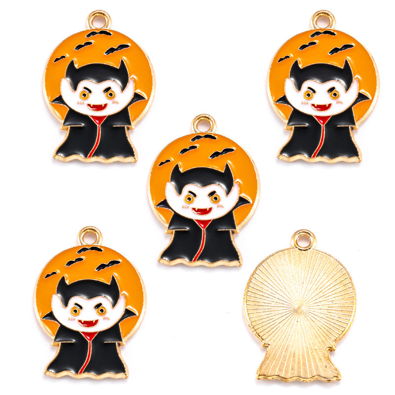 Five vampire-shaped charms with gold-tone edges and orange backgrounds
