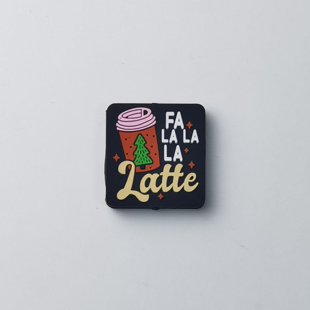 Square black silicone focal bead with red coffee cup, green Christmas tree and 'FA LA LA Latte' text