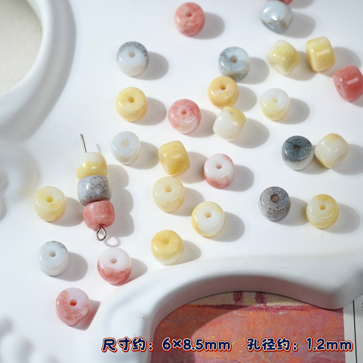 Multicolor acrylic spacer porcelain beads in pastel yellow, pink, white, gray on white