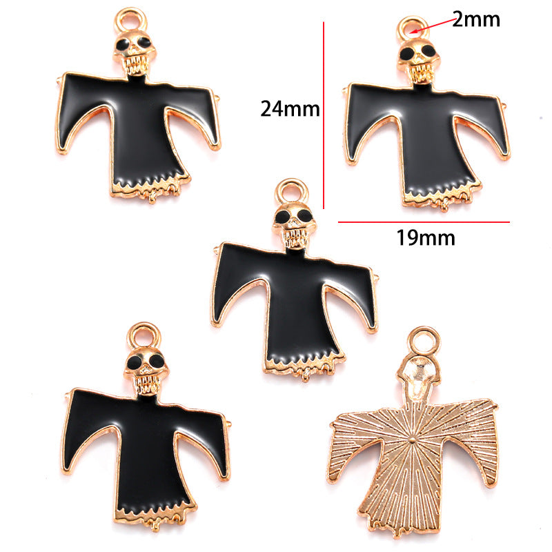 Five black and gold ghost-shaped charms with skull details, 24mm by 19mm