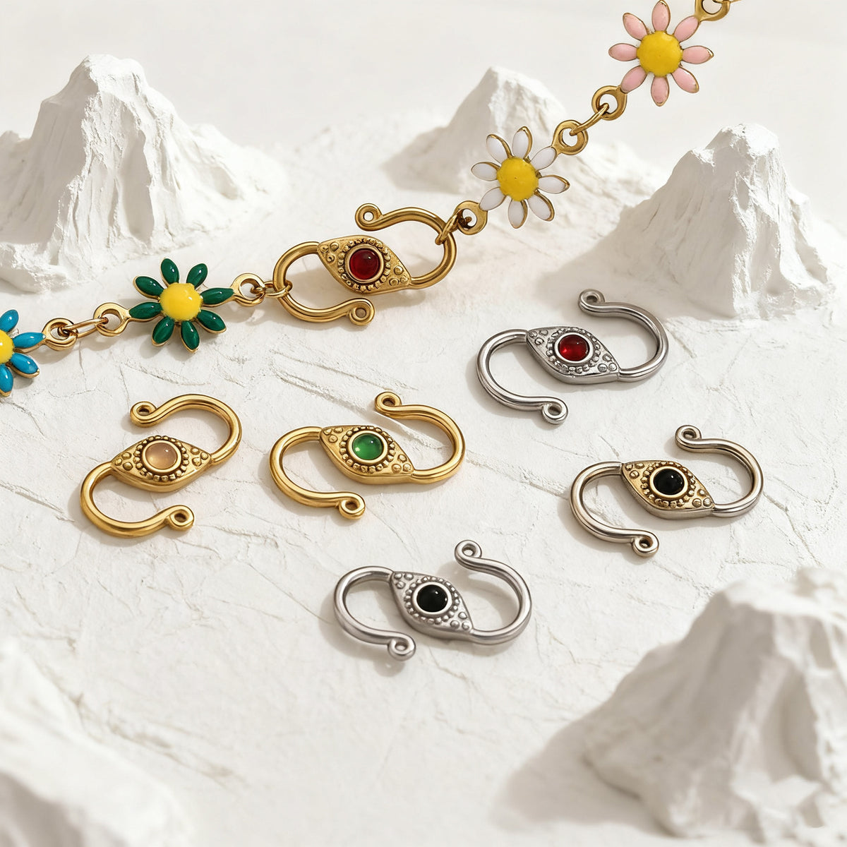 Gold and silver S-hook jewelry clasps with colorful enamel eye stones and daisy chain