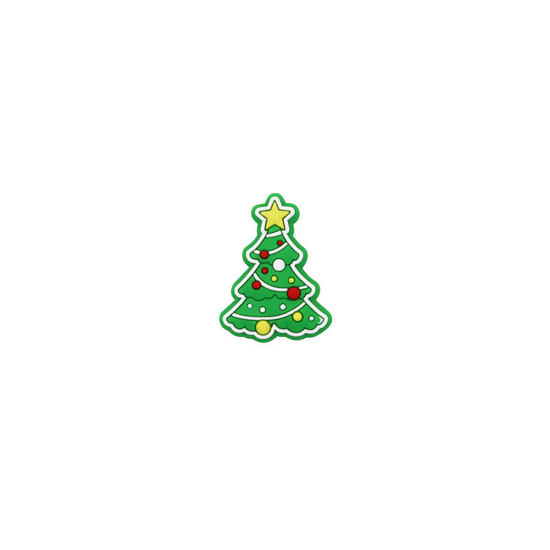 Green Christmas tree silicone focal bead with a yellow star and colorful ornaments on a white background.