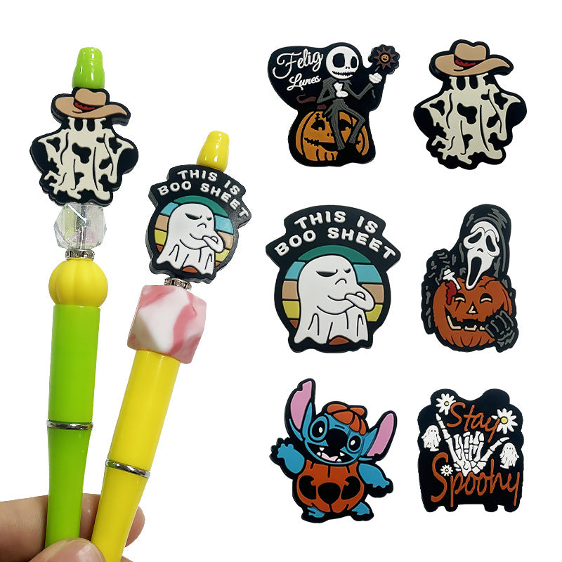 Halloween-themed pens with decorative ends featuring cartoon characters and text.