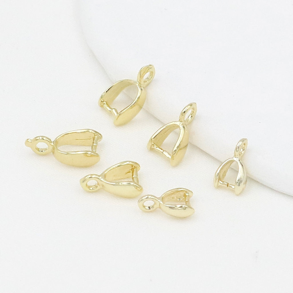 Gold-plated pinch bail pendant clasps with bell-shaped cups on a white background