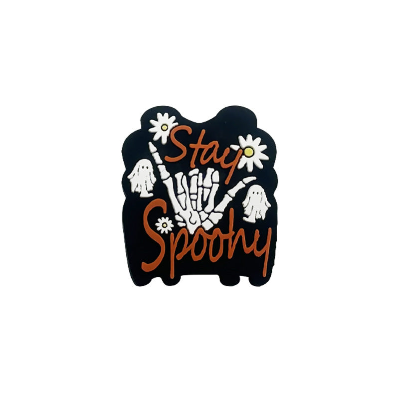 Black sticker with Stay Spooky text, skeleton hand and ghosts