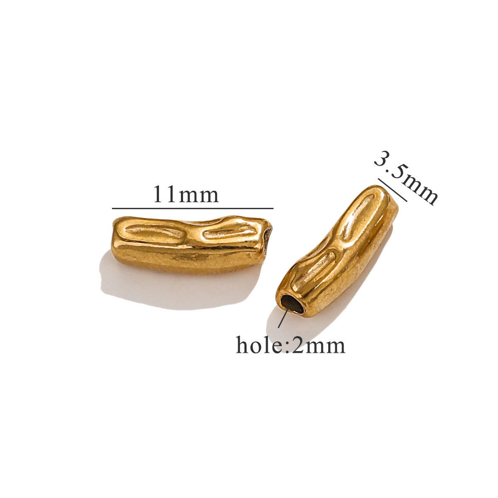 Gold-colored baroque irregular spacer beads with size measurements on white background