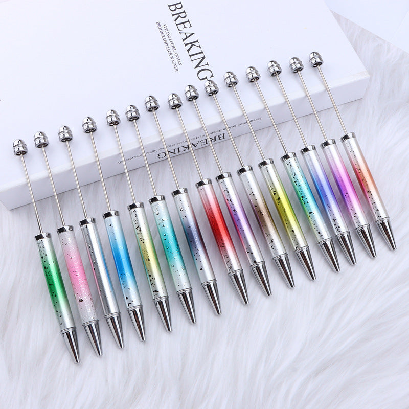 Set of gradient ombre beadable pens on a white surface.
