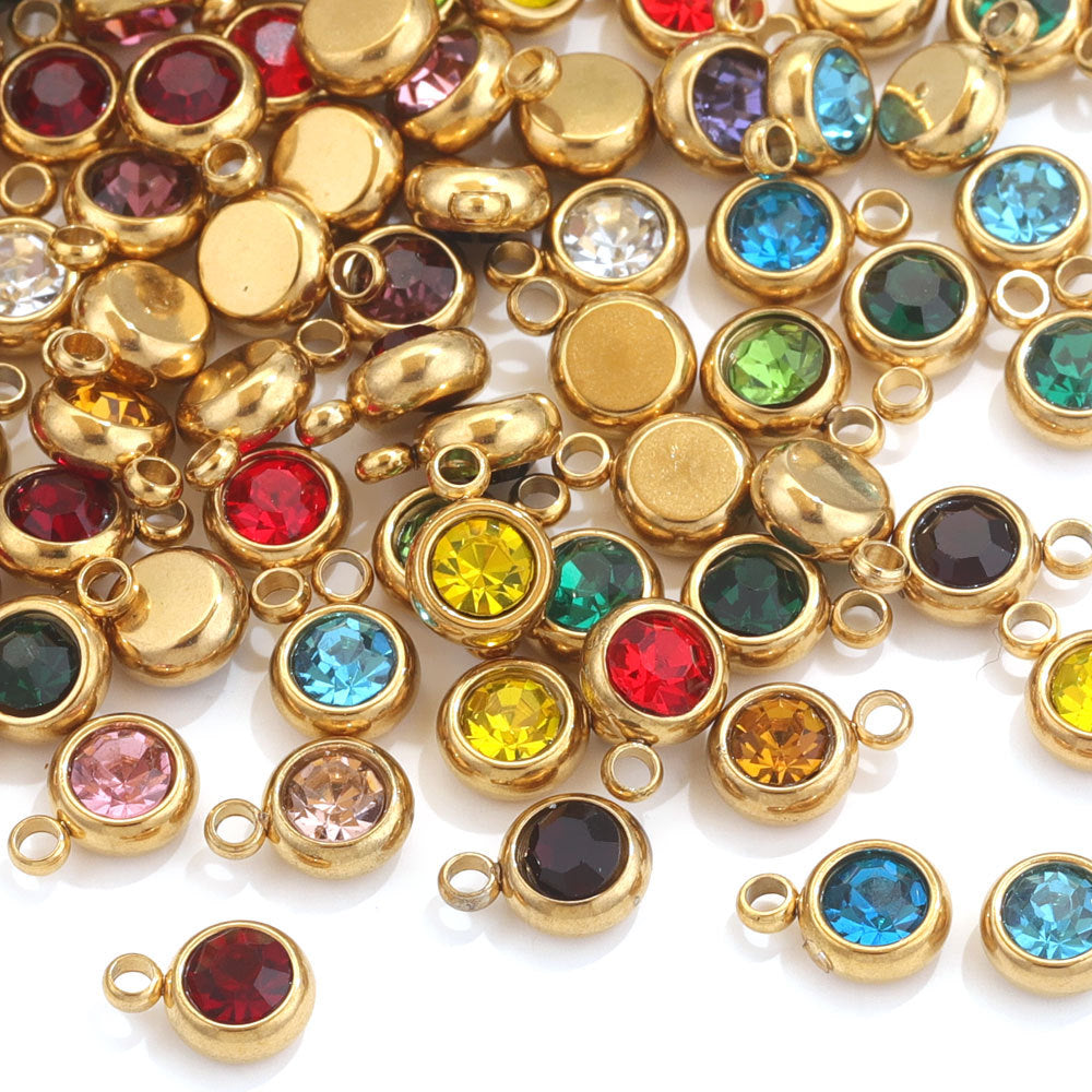 Gold-tone round bezel-set birthstone charms with loops, assorted colors