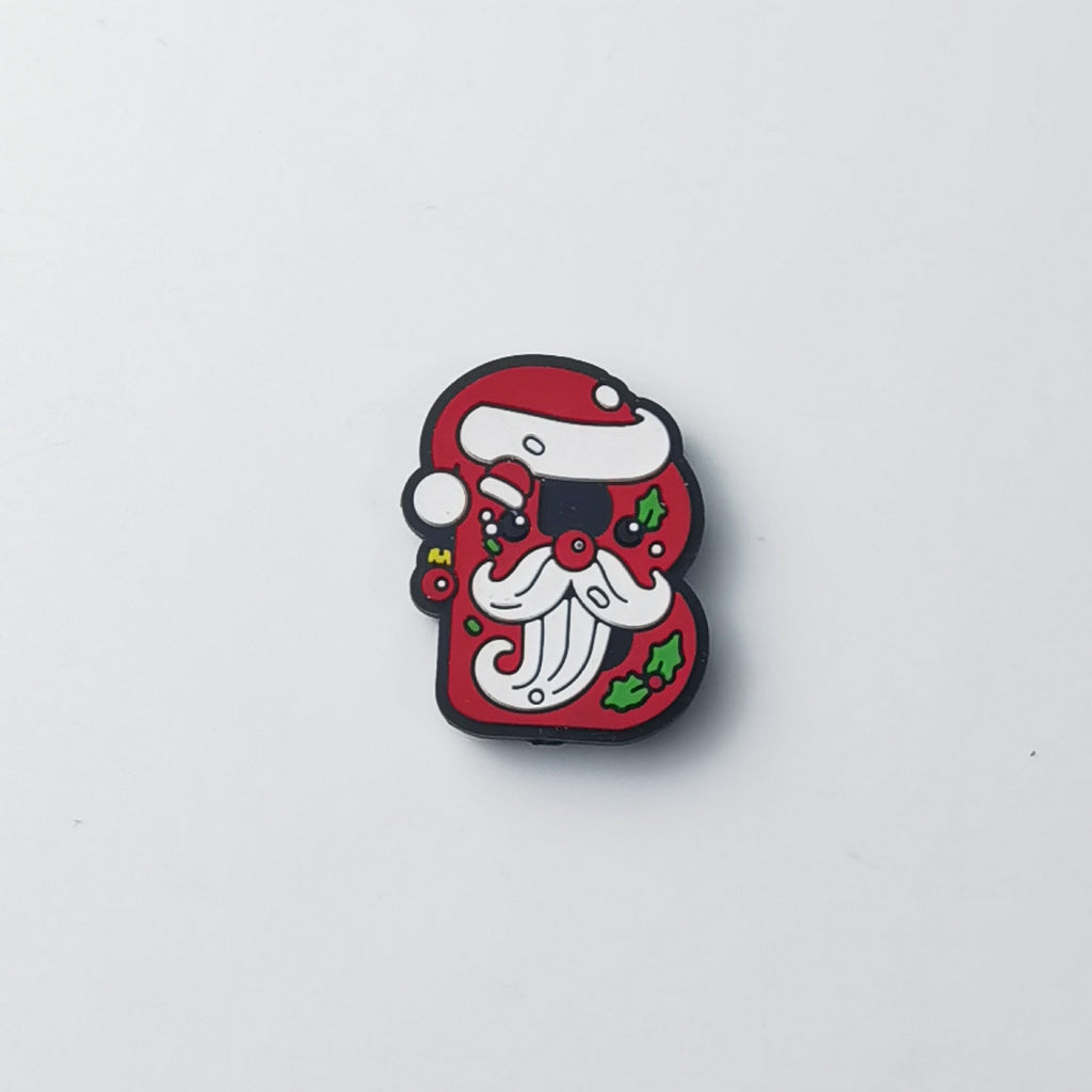 Red silicone letter B focal bead with cartoon Santa Claus face, white beard, holly leaves and red berries