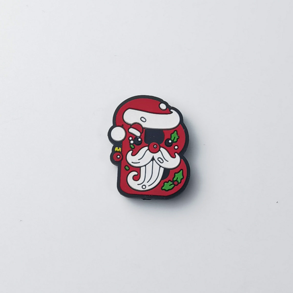 Red silicone letter B focal bead with cartoon Santa Claus face, white beard, holly leaves and red berries