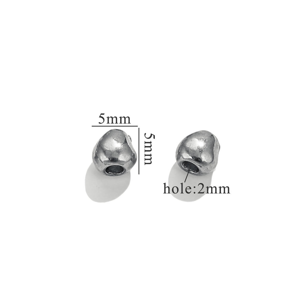 Two small steel-color baroque bead charms with dimension labels on white background