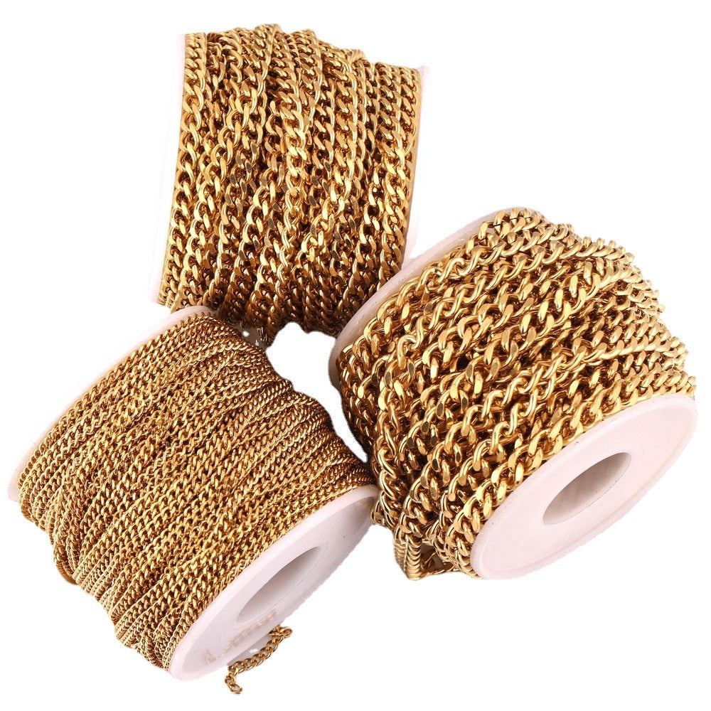 Three spools of gold-plated NK Cuban curb chain on a white background