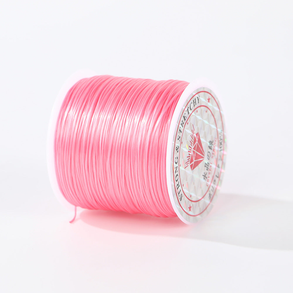 Bright pink 0.8mm flat elastic beading cord spool shown at an angle, printed label visible, white background