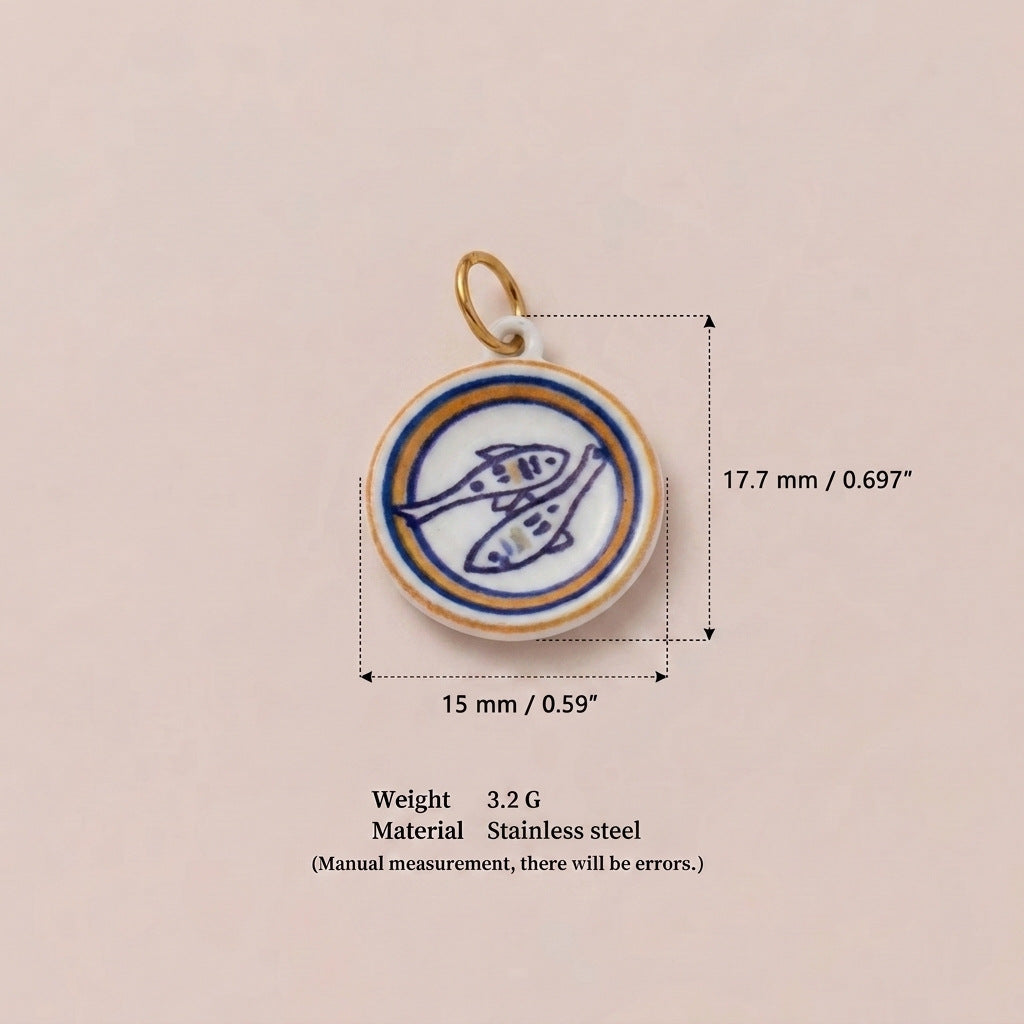 Round pendant charm with blue and white fish design, shown with size measurements.