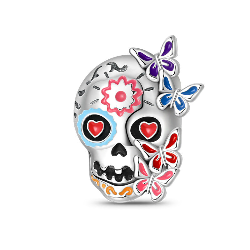 Silver-plated sugar skull bead with red heart eyes, pink enamel flower, and colorful butterflies