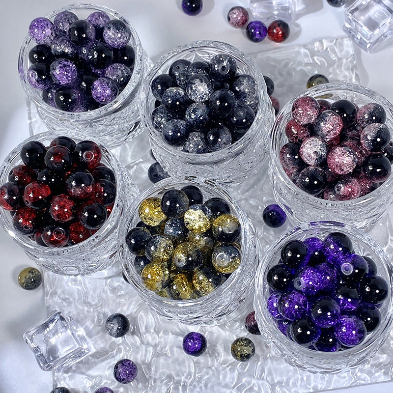 Glass bowls filled with assorted-color ice-crackle glass round beads, including black