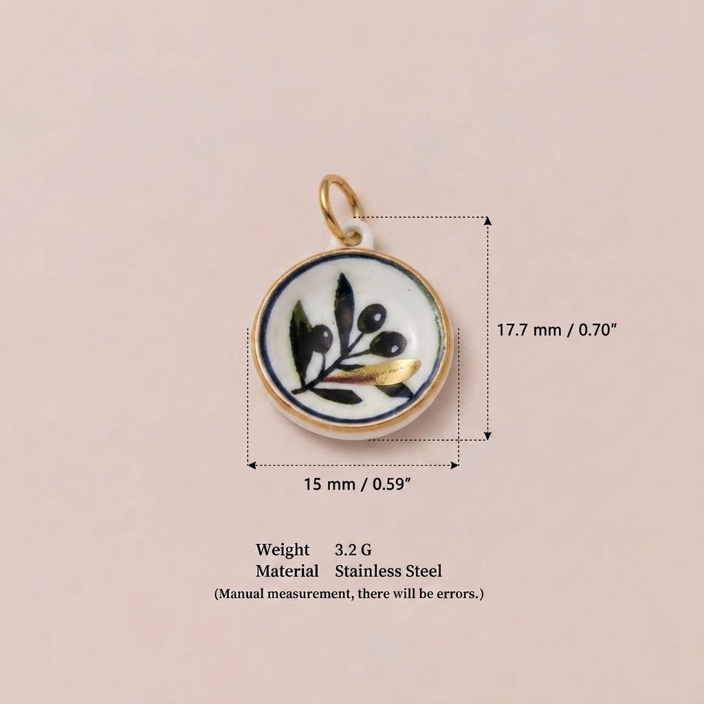 Round pendant charm with white enamel and black olive branch design, shown with size measurements.