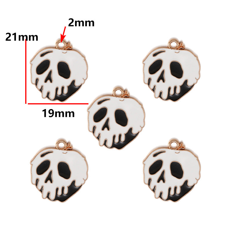 Five white enamel skull charms with black details and rose gold borders, 21mm