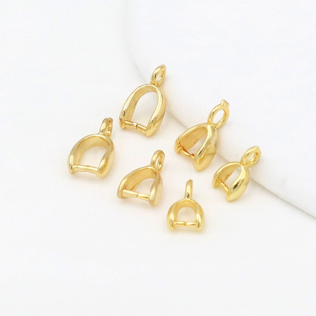Five small gold-plated pinch bail pendant clasps with attached loops on a clean white background