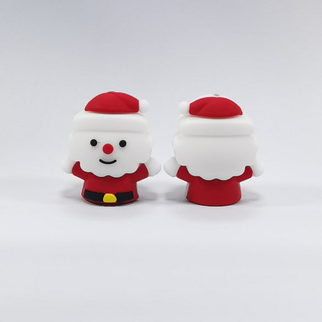Two Santa Claus silicone focal beads in red suits with white beards, one facing front and one facing back
