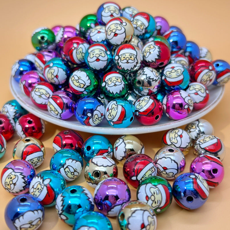 Colorful Santa Claus printed acrylic round beads piled on a white plate with some scattered around