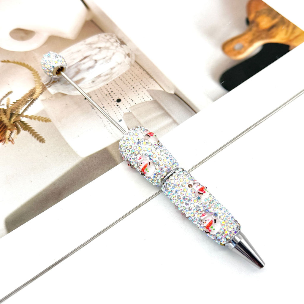 Rhinestone ballpoint pen with printed cartoon character pattern.