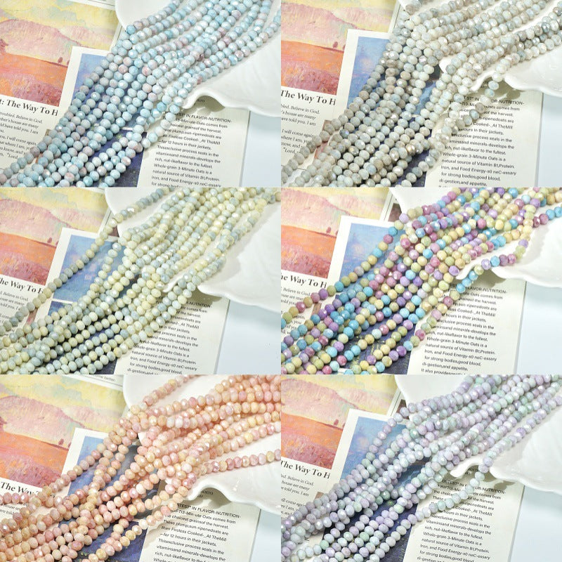 Six panels of soft-color faceted porcelain bead strands arranged on printed book pages