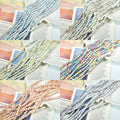 Six panels of soft-color faceted porcelain bead strands arranged on printed book pages