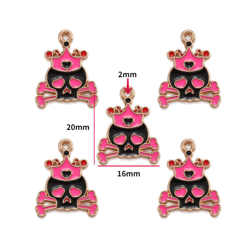 Five gold-tone skull and crossbones charms with pink crowns, 20mm