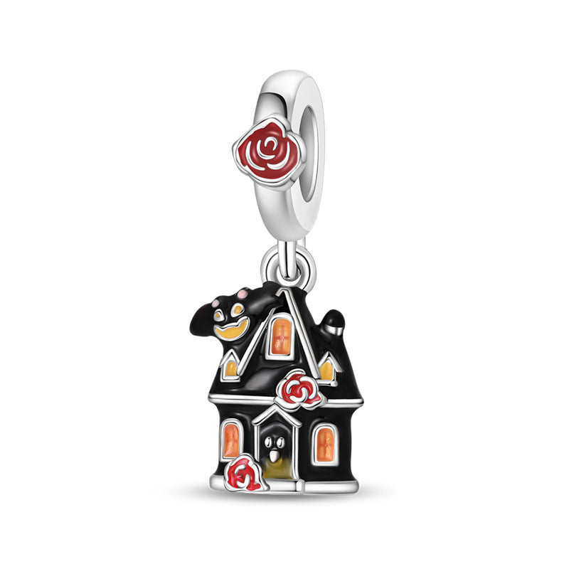 Silver-plated haunted house dangle charm with black enamel, orange glowing windows, and red roses